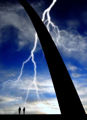 30990375 - base of st. louis arch with silhouette of two people and lightning